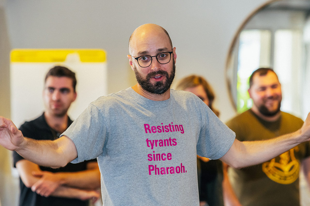 A group leader instructing Birthright Israel Fellows at a training seminar.